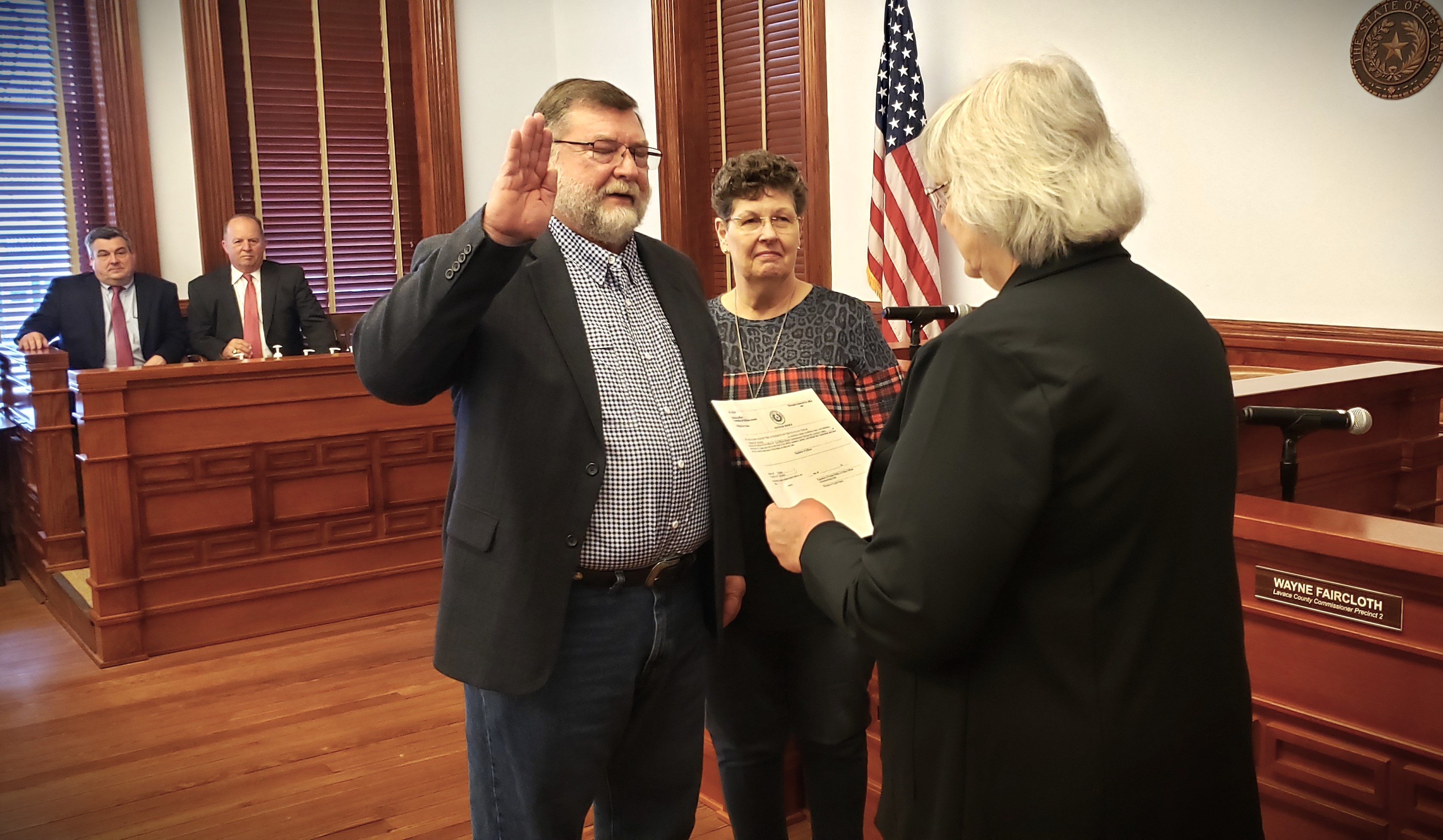 Dennis Kocian takes his oath office wife his bride Shirley at his side.