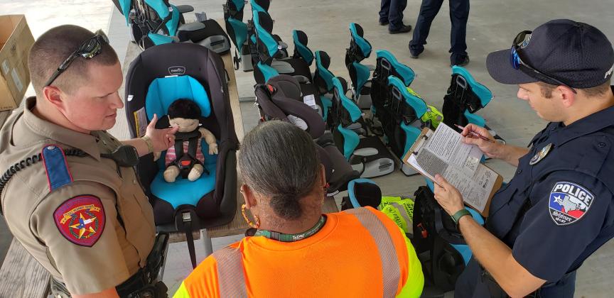 Shiner police, TxDOT, Texas DPS, Texas Agrilife Extension Service, emergency managent personnel and members of the Kaspar Foundatioin gathered at Green Dickson Park for the first-of-its-kind kids' car seat checkout.d 