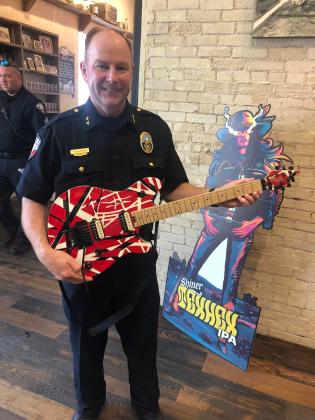 Chief Kevin Kelso looks quite the rock star with this rather distinctive axe from the early era of music videos on MTV. Contributed Photo