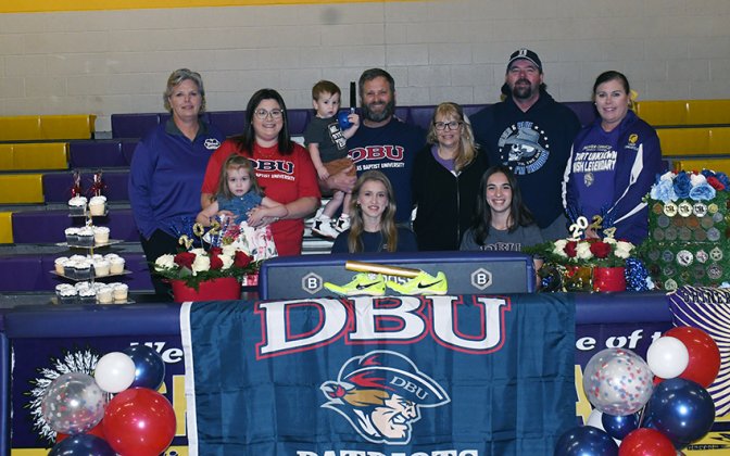 Shiner senior Hayleigh Burns signed with Dallas Baptist University to run track. Her signing ceremony took place on March 26.  Seated from left are Hayleigh Burns and Megan Burns. Standing from left are Kristi Peterson, Ashley Burns, Harper Burns, Samuel Burns, Logan Burns, Gigi Monk , Pawpaw Monk and Michelle Winkenwerder. Photo by Mark Lube.