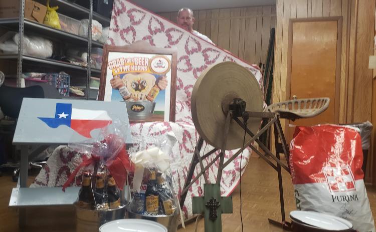 Deacon Michael Morkovsky helps us display a sampling of the many fine wares in Sunday’s noon auction, including hand stitched quilts, Shiner beer collectibles, antiques, furniture and all sorts of other great items. Head over to the Shiner KC Park, 102 S. Ave. G, for a whole day of fun. See you there! 