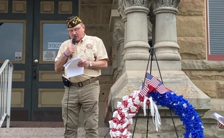 David Bright takes his turn reading from the Declaration of Independence on the courthouse steps this past July Fourth.